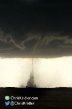 A graceful funnel reaches the ground.