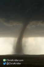 The tornado kept growing. Rain creates texture in the photograph.