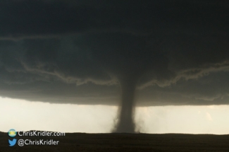 A hint of green in the mesocyclone as the tornado churns.