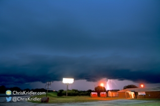 More lightning under the line of storms.