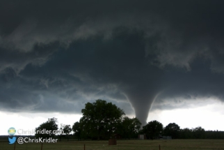 The tornado grows and gets closer.