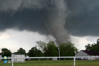 Debris and dust wrap around the tornado.