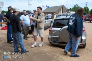 Chaser Dan Shaw (center) talks with folks during the event in Wakita.