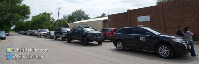 Chase vehicles line up for an impromptu parade.