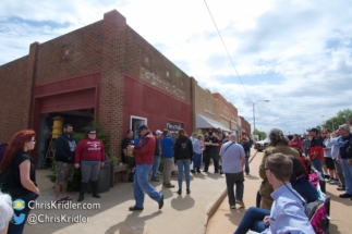 Lots of folks hang around the Twister Movie Museum.