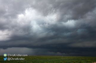 A cone tornado appeared about 4:32 p.m. CDT, obscured by the rain and hail.