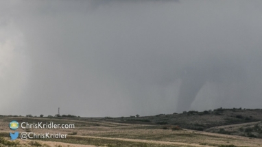 The tornado vanished into the rain, almost a cone at this point.