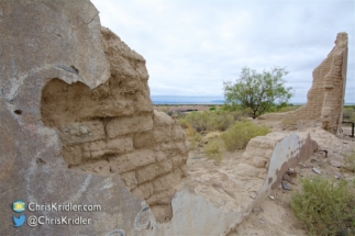 Adobe brick is exposed at the decaying hotel site.