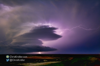 The storm weakened but produced continuous lightning as the sky darkened.