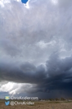 The wall cloud persisted under the storm.