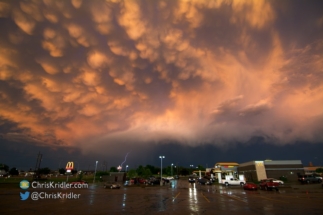 To the east, hail and lightning fell from a storm amid the mammatus display.