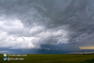 The storm was especially beautiful over a wheat field.