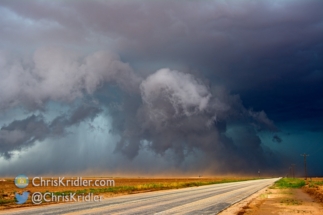 The lowering crosses the road.