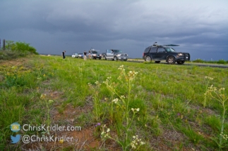 The line of storm-chasing vehicles.