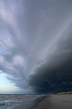 The shelf cloud moved out over the ocean.