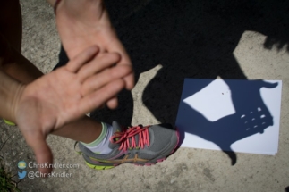 Alethea made tiny crescents by filtering the sun with her fingers.