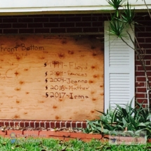 Our neighbors' window boards have been through a lot.