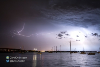 I like the way the lightning illuminated the boats.