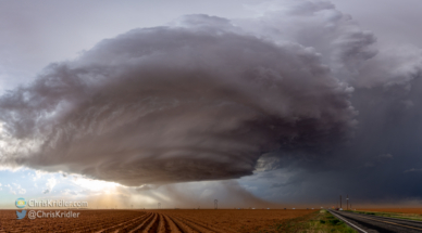 A stitched panorama shows some of the structure over the dusty fields.