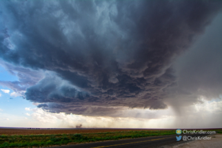 A gustnado spins up under the storm, well east of Welch.