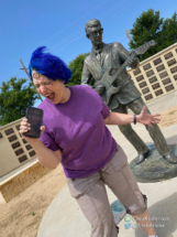 Alethea sings along with Buddy.