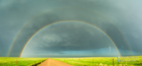 The sun lit up the rain and hail, creating a rainbow. Or hailbow.