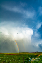 The hail reflected the light, creating the white color as it fell.