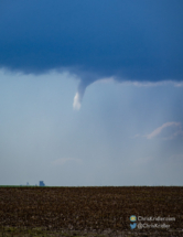 Sunlight caught part of the funnel cloud.