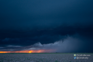 ... and a fiery sun under storm clouds to the west.