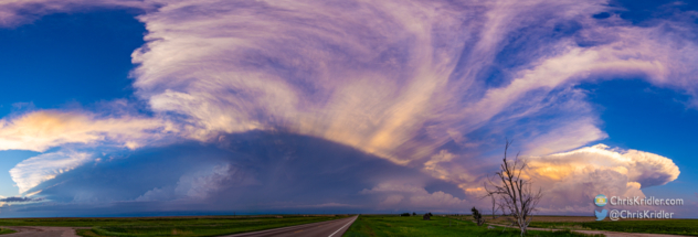 This panorama catches the shadows cast by the storms in the sunset.