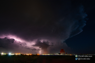 A bolt hit the ground as lightning crawled through the clouds.