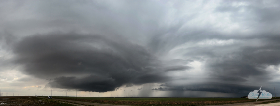 An iPhone panorama shows a pair of storms near Clovis.