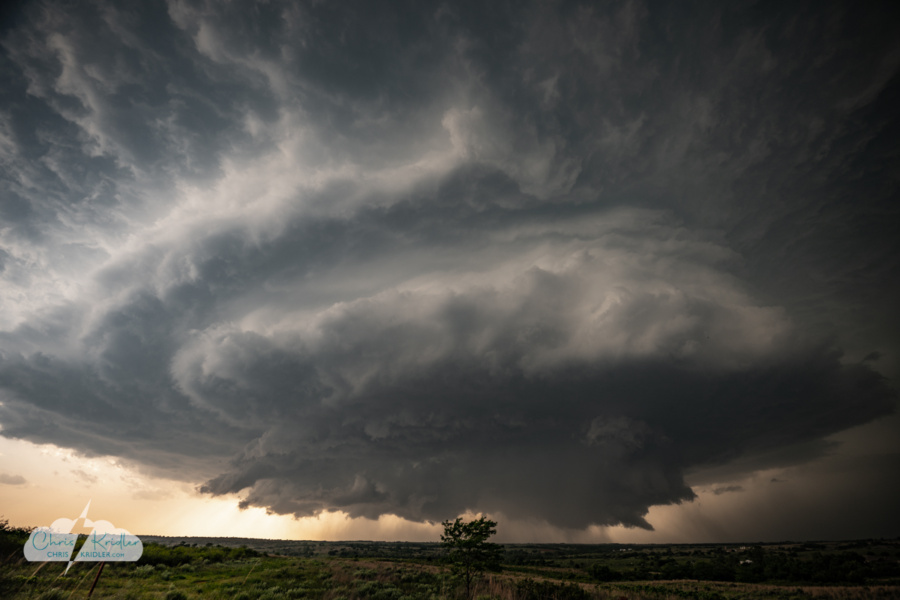 spinning supercell with tree, by Chris Kridler
