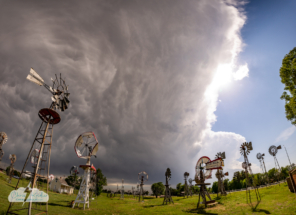 Panoramic shot of the windmill park and storm.