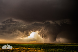 At 7:33, the fat tornado seemed to be moving toward a wedge appearance. At one point it was more than a mile wide.