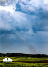 Near Medicine Lodge, we saw our first tornado of the day. It was white from our viewpoint and almost lost in the haze. Image enhanced for contrast.