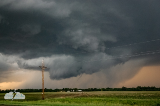 The multi-funnel wall cloud managed to connect with the ground with at least this one, slim tornado.