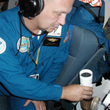 OVER THE CARIBBEAN, SEPT. 2, 2004 - NOAA electronics technician James Barr puts a dropsonde - a capsule instrumented with weather sensors - in a tube so it can be dropped into the periphery of Hurricane Frances. He&#039;s part of the crew of the Gulfstream IV NOAA hurricane hunter plane.