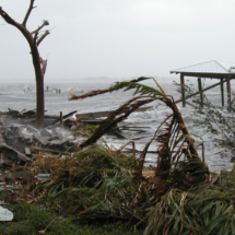 Huge waves damage a boathouse in Rockledge, Florida, and push debris onto the shores of the Indian River Lagoon around 9 a.m. Sept. 26, 2004, as Hurricane Jeanne passed through.