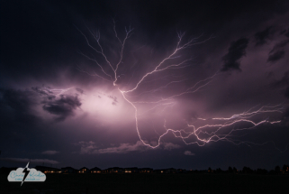 A lightning crawler shoots across the sky east of Kissimmee over a suburban neighborhood.